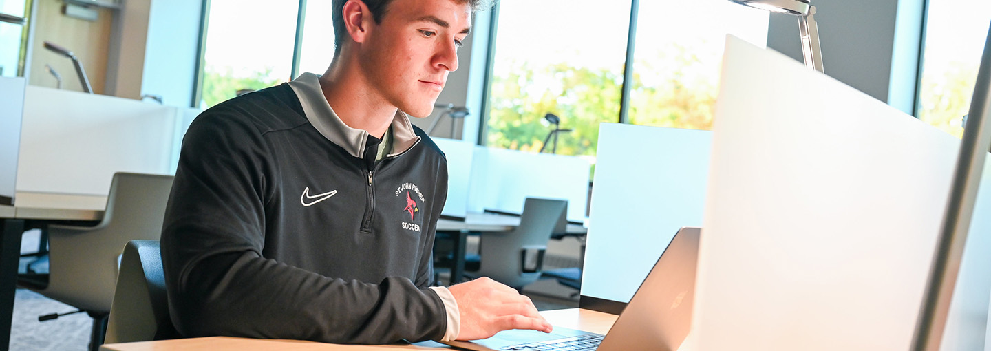A student uses AI technology on a laptop in Lavery Library.