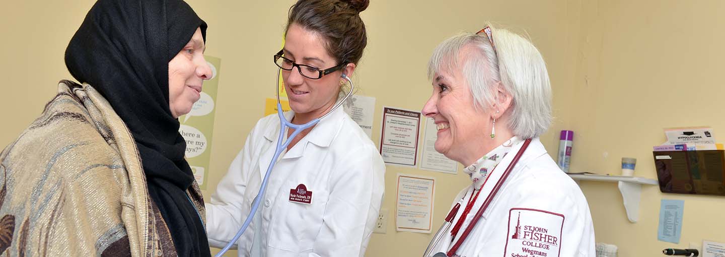 Nursing student with faculty and patient