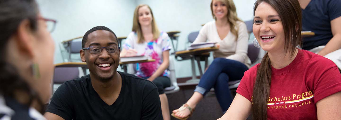 Smiling students in front of teacher