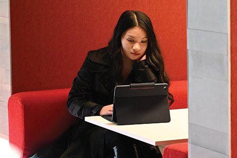 A student works on an iPad.