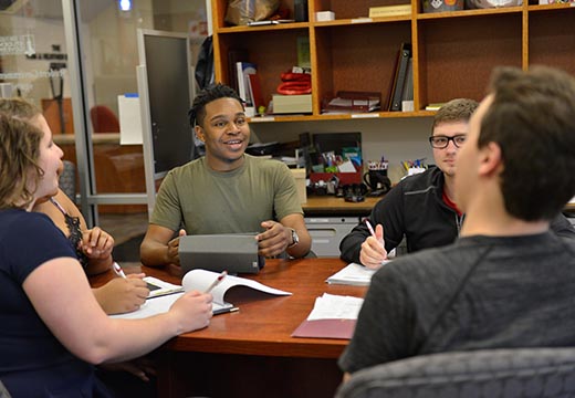 Students at table in SGA office.