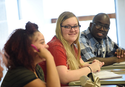 Students seated at desks in a classroom.