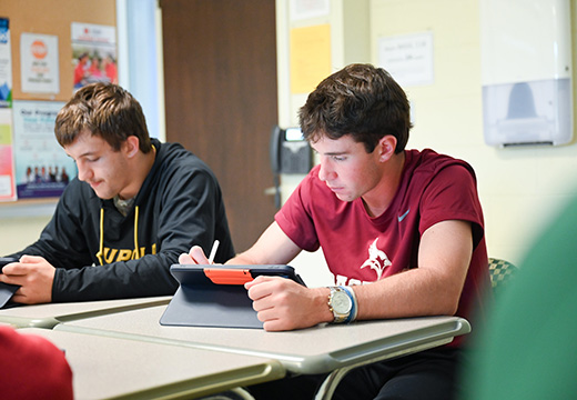 Students working on their iPads during class.