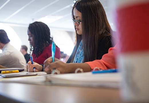 Students taking notes in class