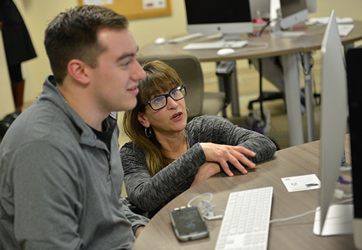 Student and faculty member working together